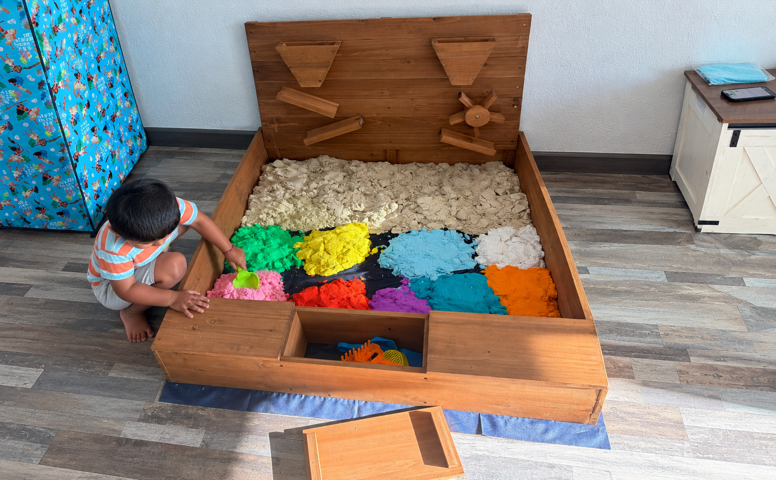 Sandbox at Fun Together — Kinetic sand, shovels, molds, and dinosaurs. Dig, build, bury, and discover — the good kind of mess.